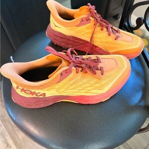 Hoka Vibrant Orange and Red Athletic Shoes